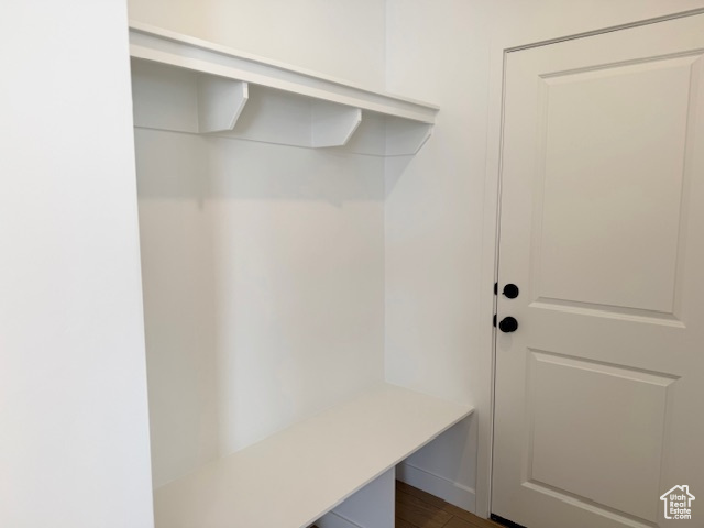 Mudroom featuring dark wood-type flooring