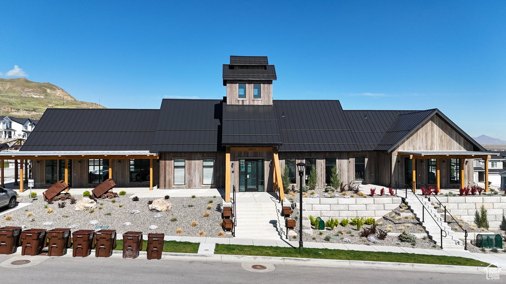Back of house featuring a standing seam roof, metal roof, and a mountain view