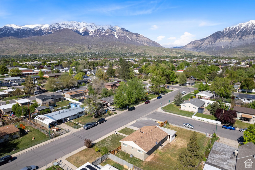Aerial view of residential area featuring a mountain backdrop