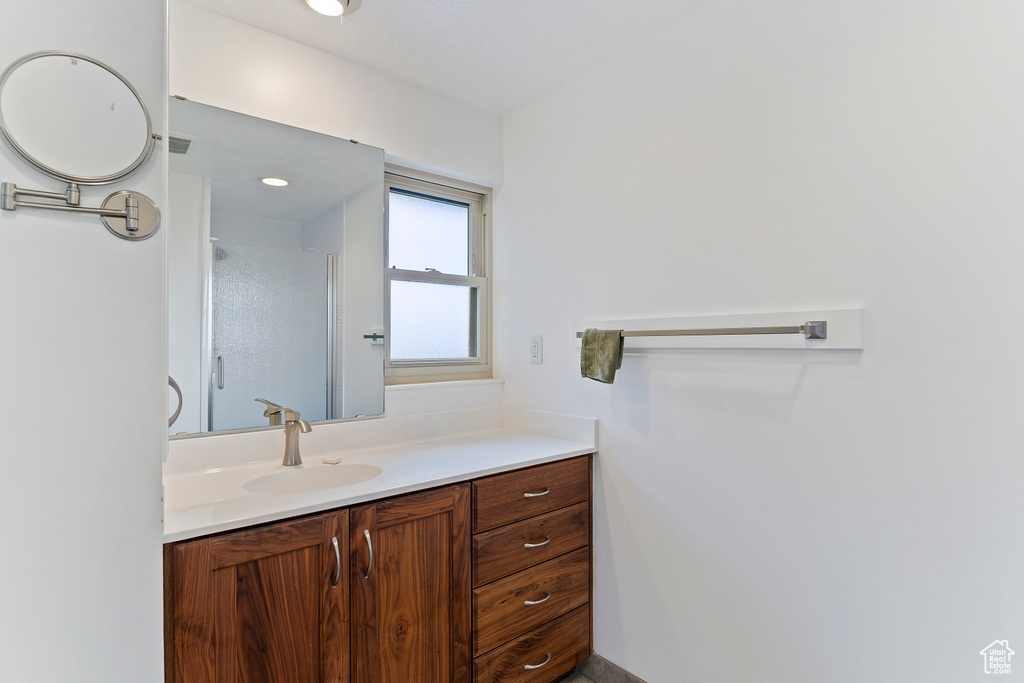 Bathroom with vanity and walk in shower