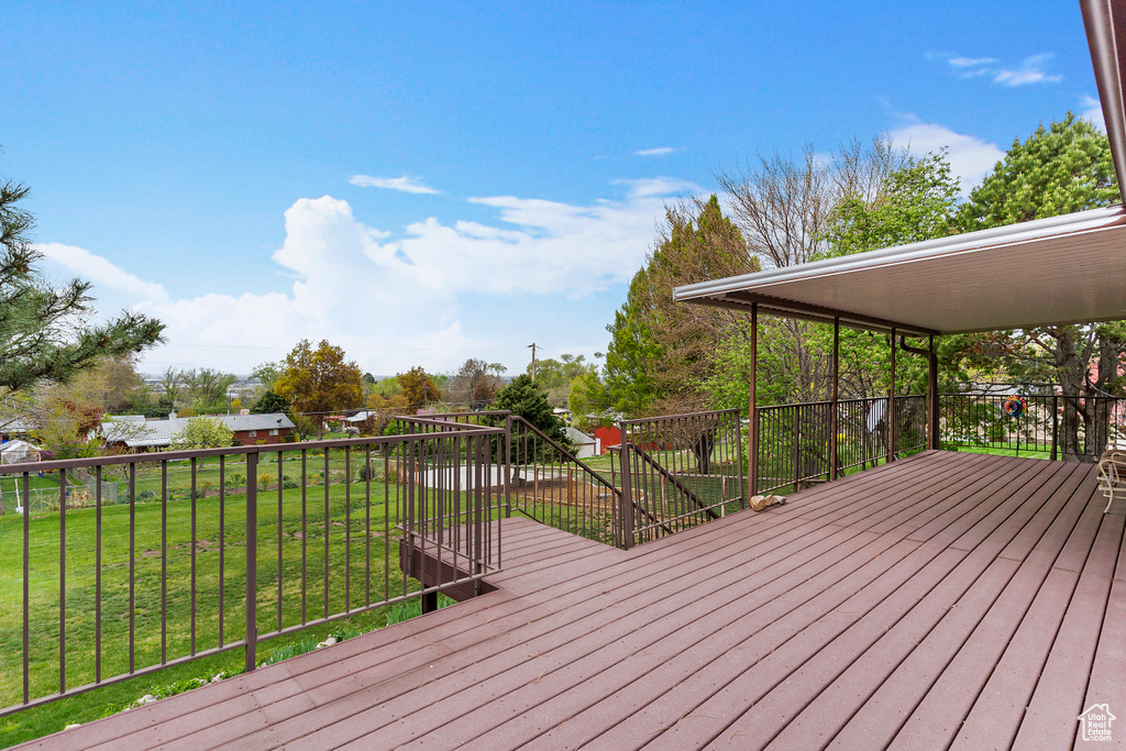 Deck featuring a yard