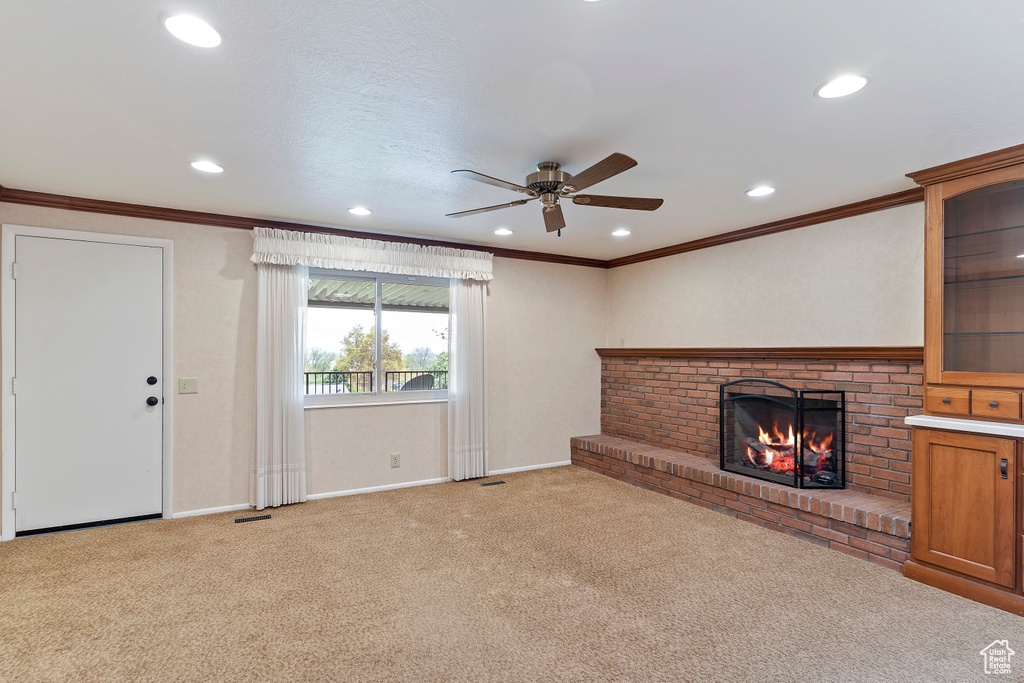 Unfurnished living room featuring ceiling fan, recessed lighting, and light colored carpet
