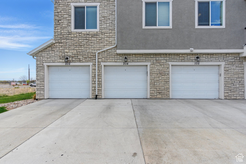 Garage featuring driveway