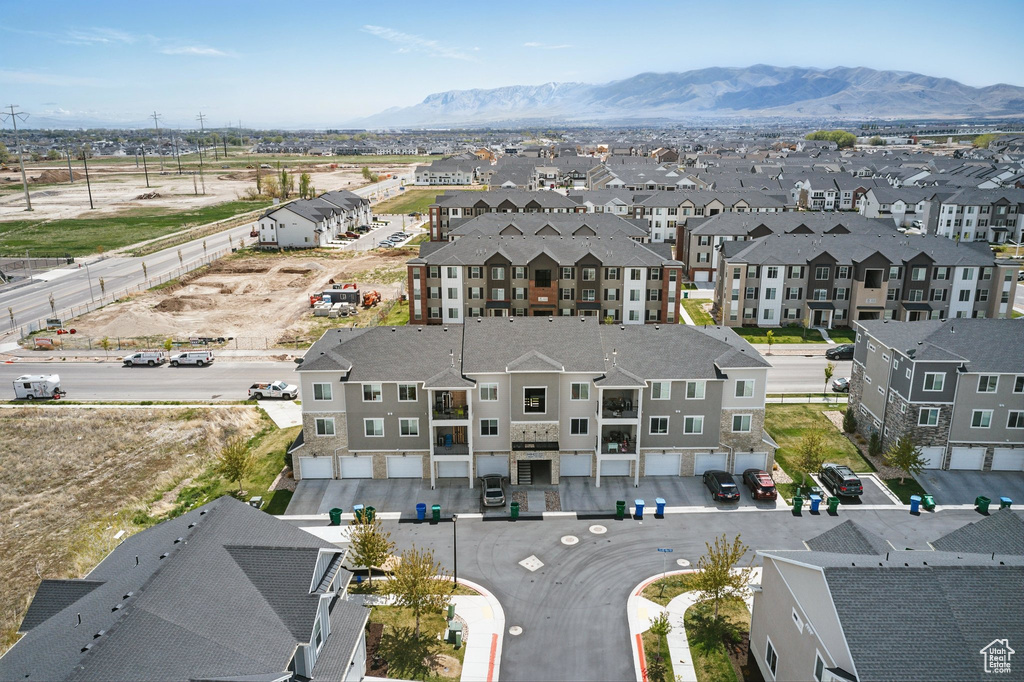 Birds eye view of property featuring a mountain view and a residential view