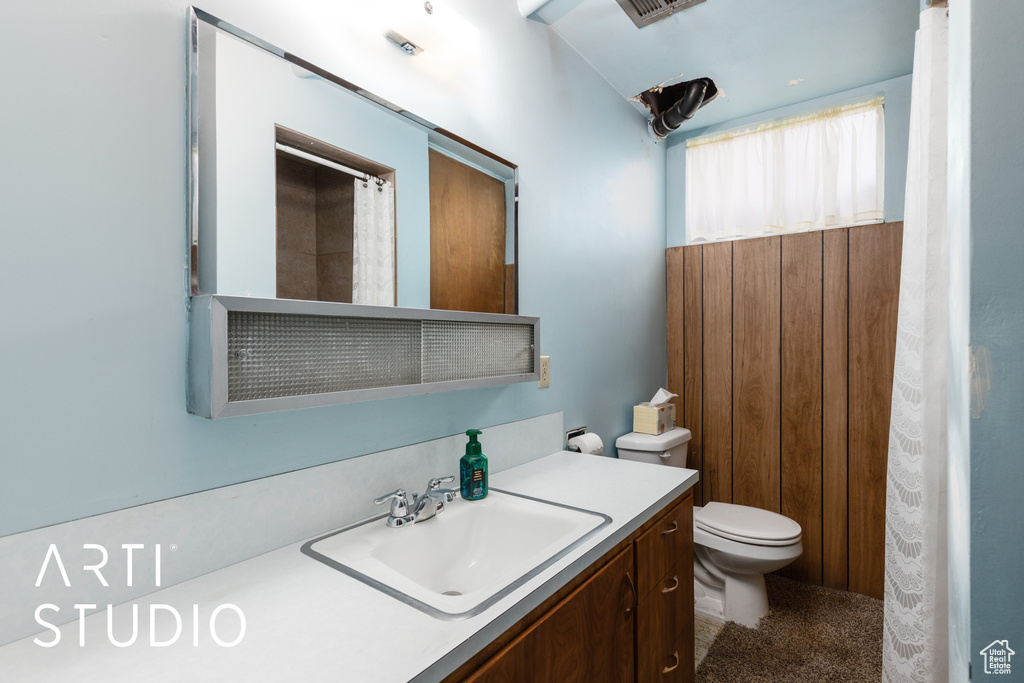 Bathroom featuring vanity and toilet