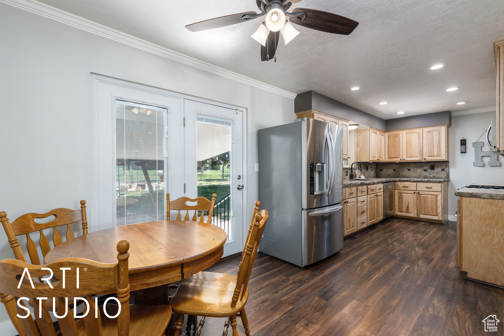 Dining space with dark wood-style flooring, ceiling fan, recessed lighting, and ornamental molding