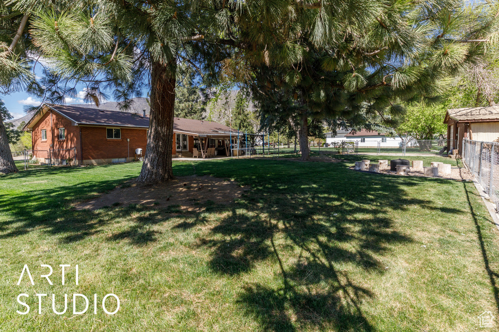 View of yard with fence