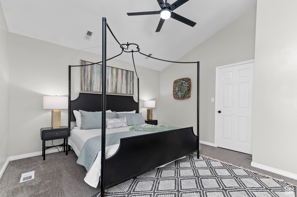 Bedroom featuring visible vents, carpet floors, baseboards, ceiling fan, and high vaulted ceiling