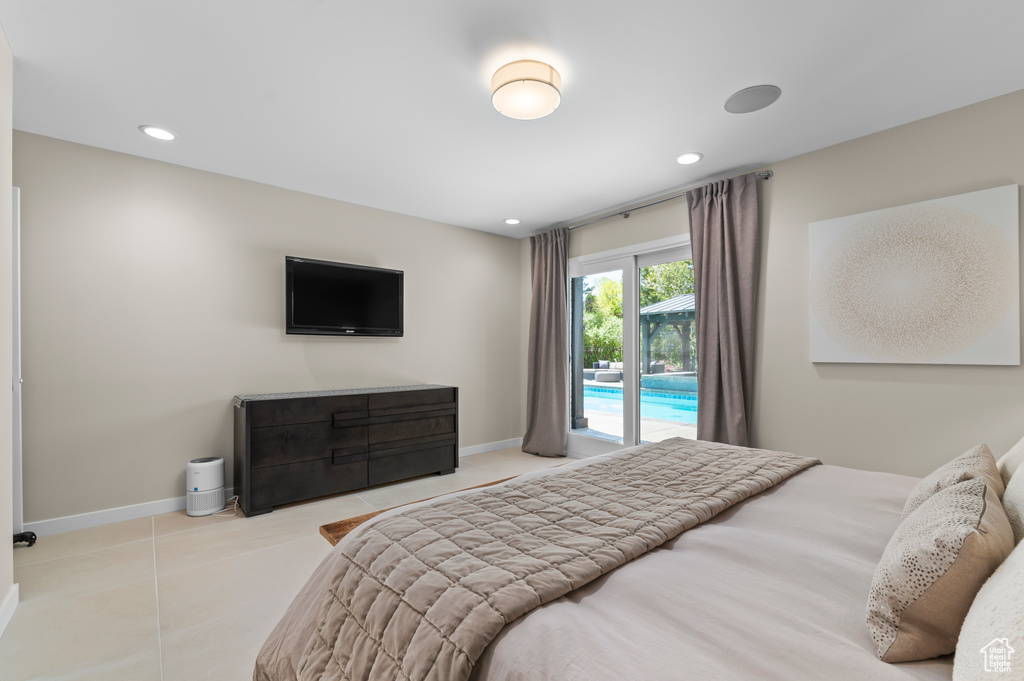 Bedroom featuring recessed lighting, tile patterned floors, access to exterior, and baseboards