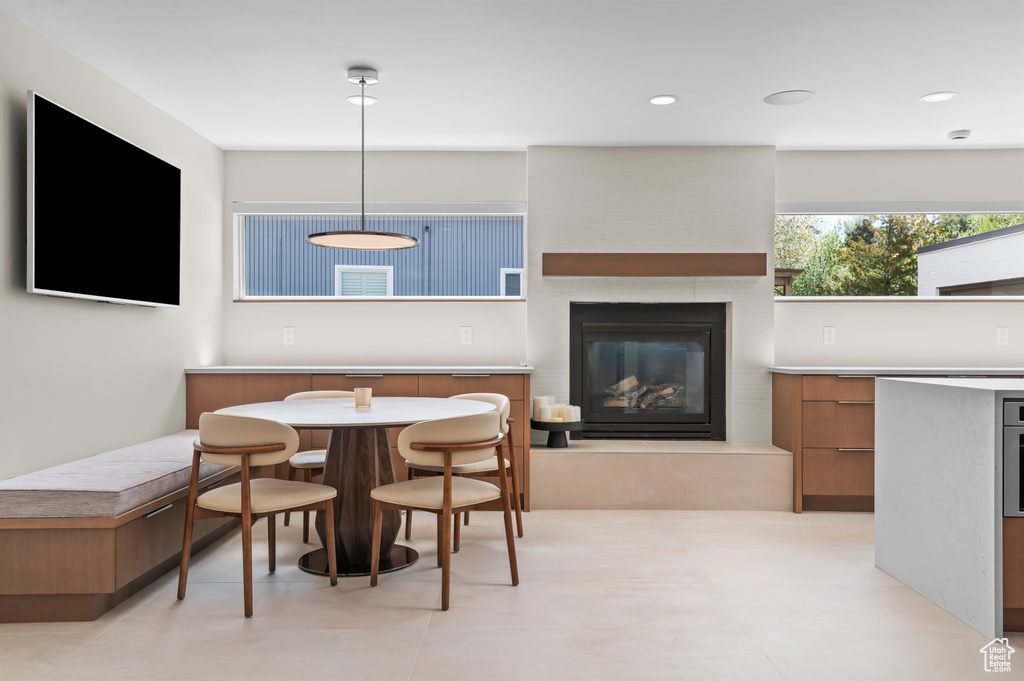 Dining area featuring a fireplace and recessed lighting