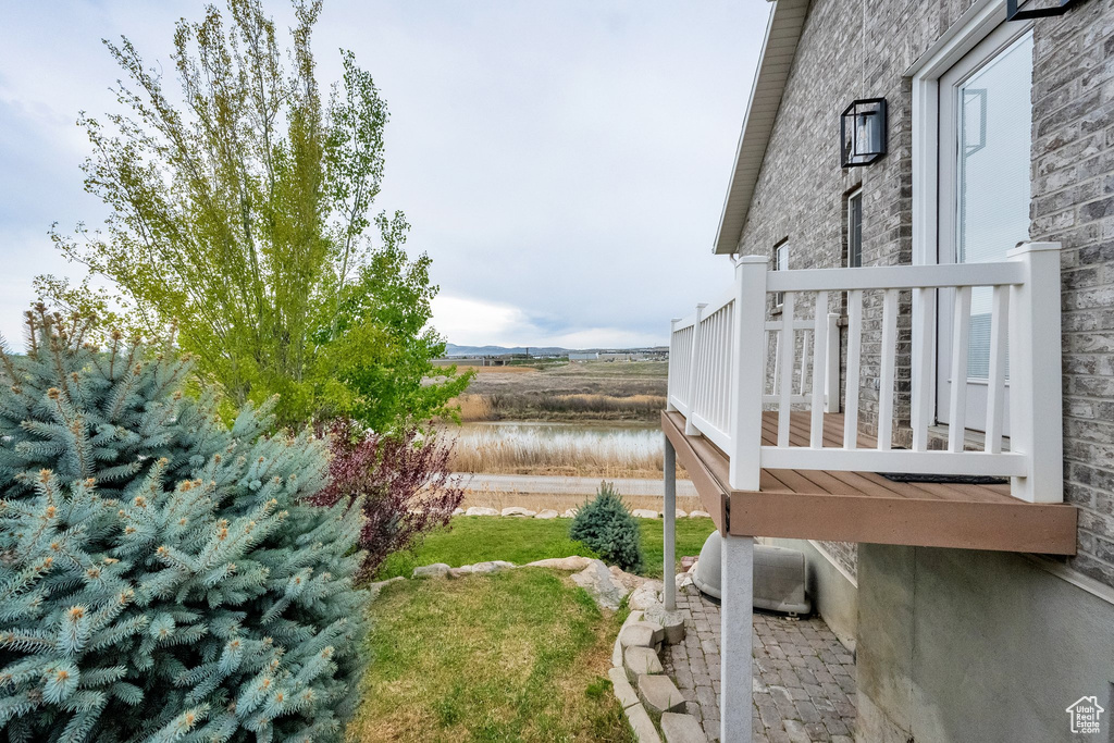 View of yard with a water view