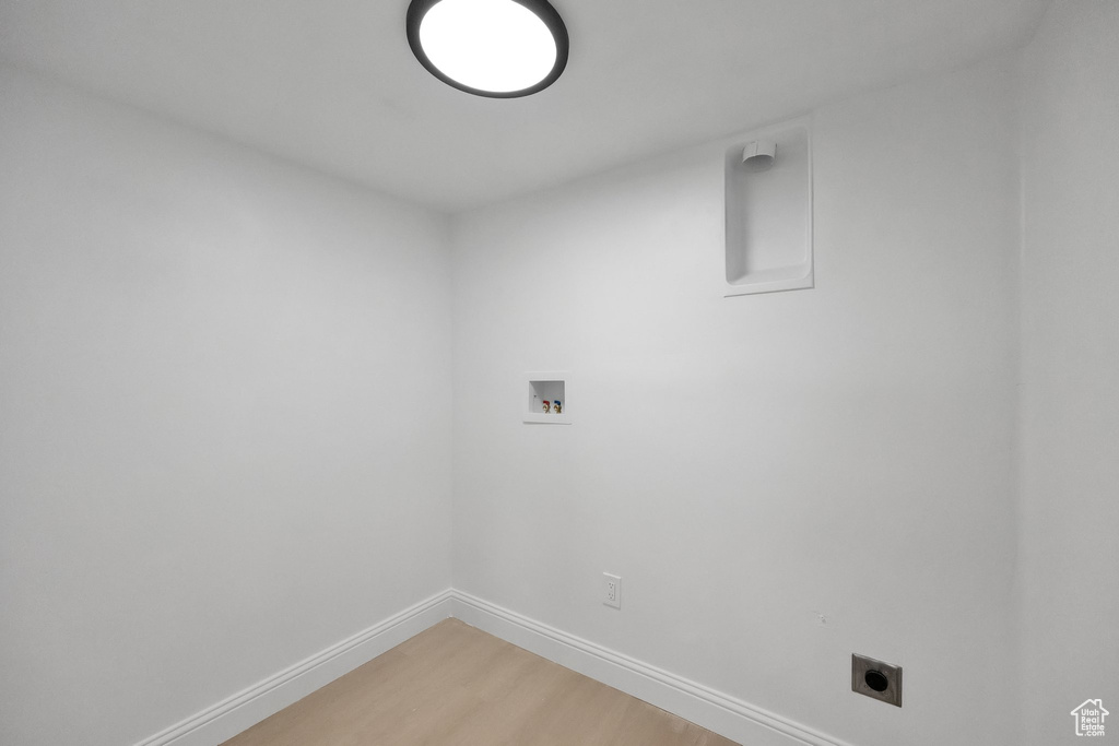 Laundry room with washer hookup, laundry area, electric dryer hookup, baseboards, and light wood-style floors