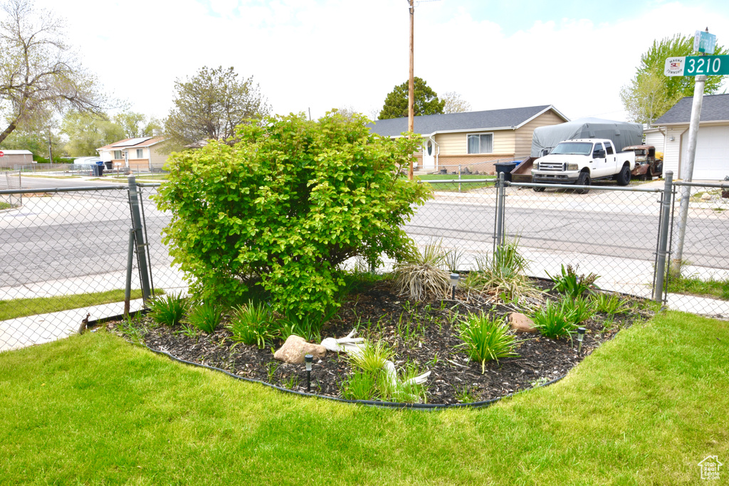 View of yard featuring a gate and fence