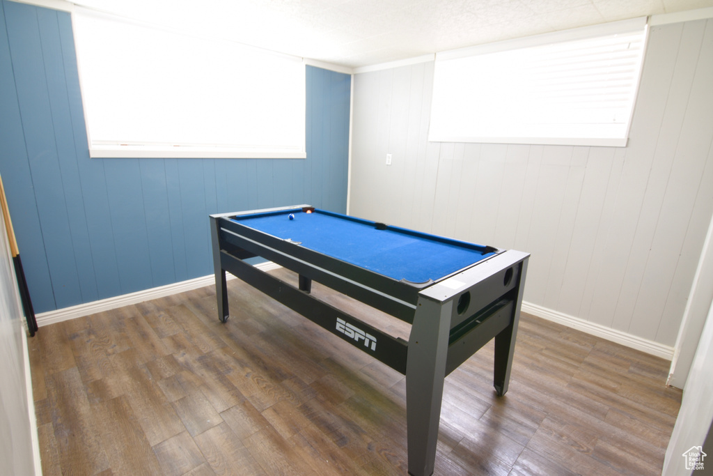 Playroom featuring wood finished floors and baseboards