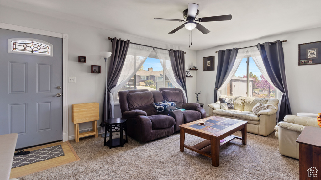 Living room featuring a ceiling fan