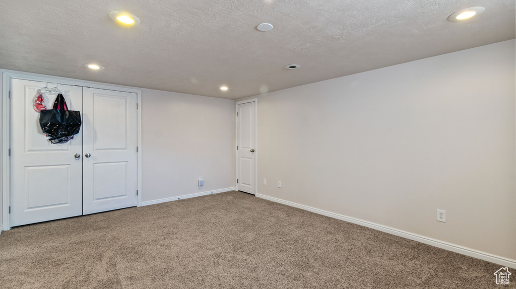 Interior space featuring carpet floors, recessed lighting, and baseboards