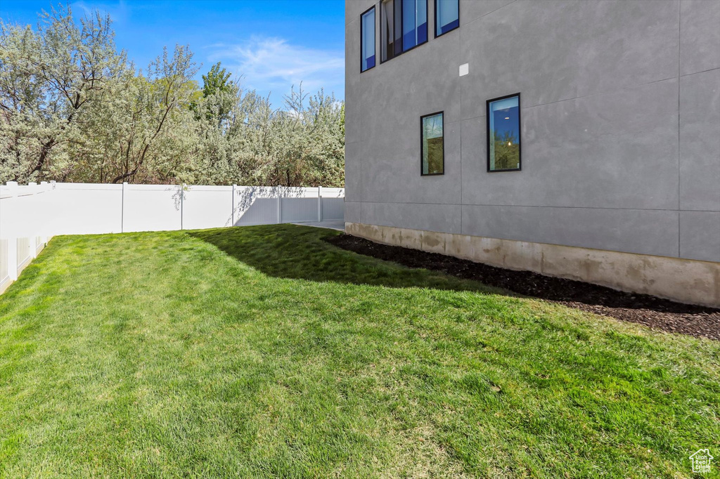 View of yard with a fenced backyard
