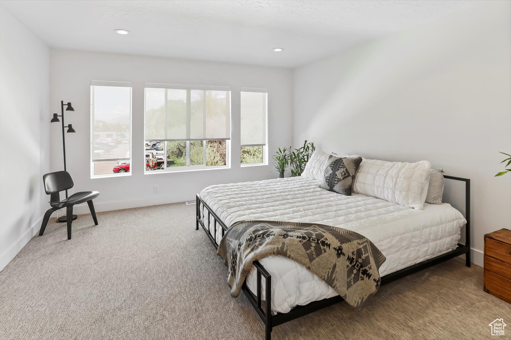 Bedroom featuring carpet floors, recessed lighting, and baseboards