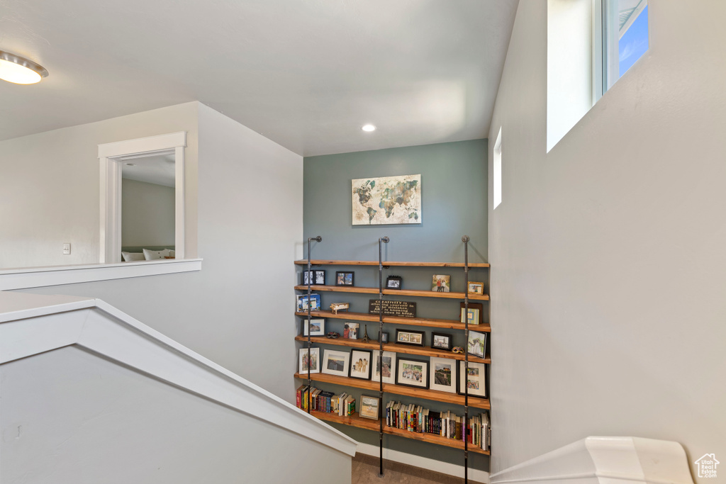 Stairway with recessed lighting and baseboards