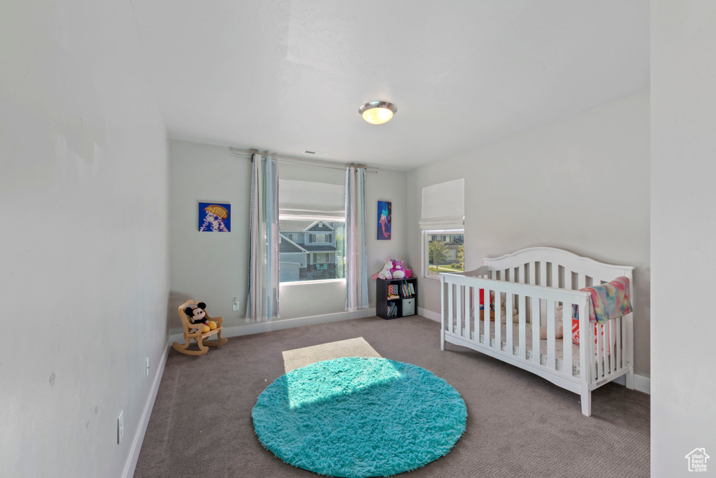Carpeted bedroom with baseboards
