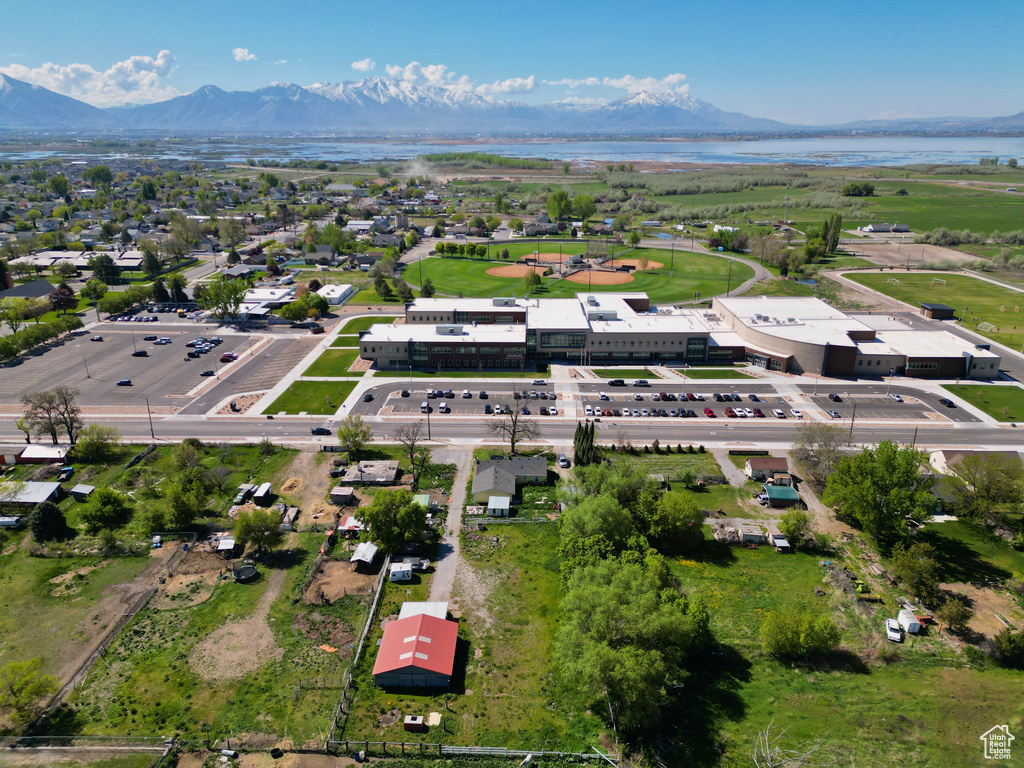 Drone / aerial view with a water and mountain view