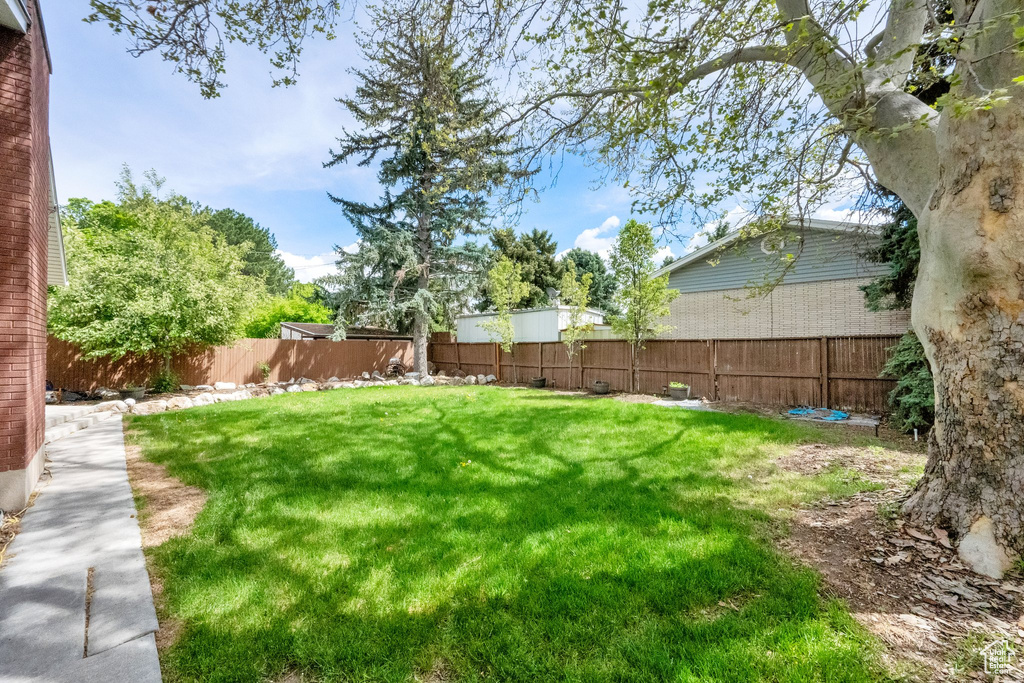 View of yard with a fenced backyard