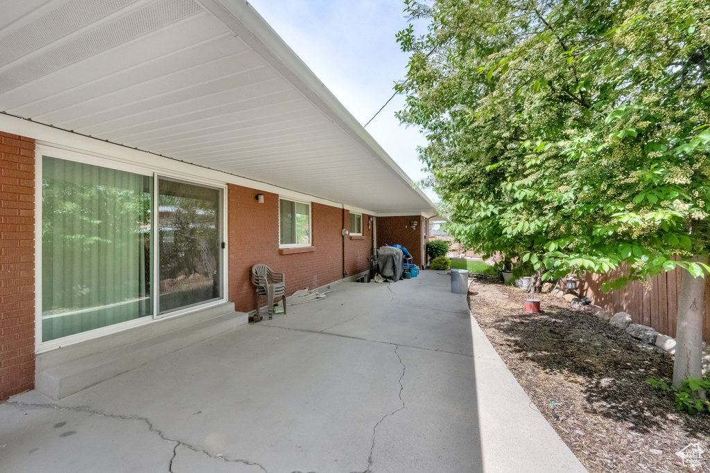 View of patio with fence