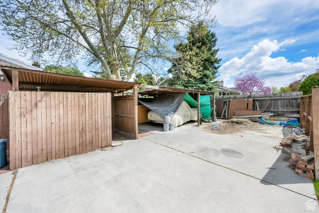 View of patio with fence