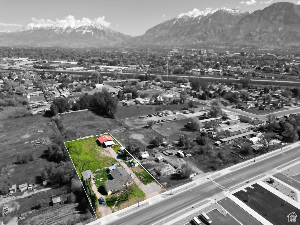 Birds eye view of property with a mountain view