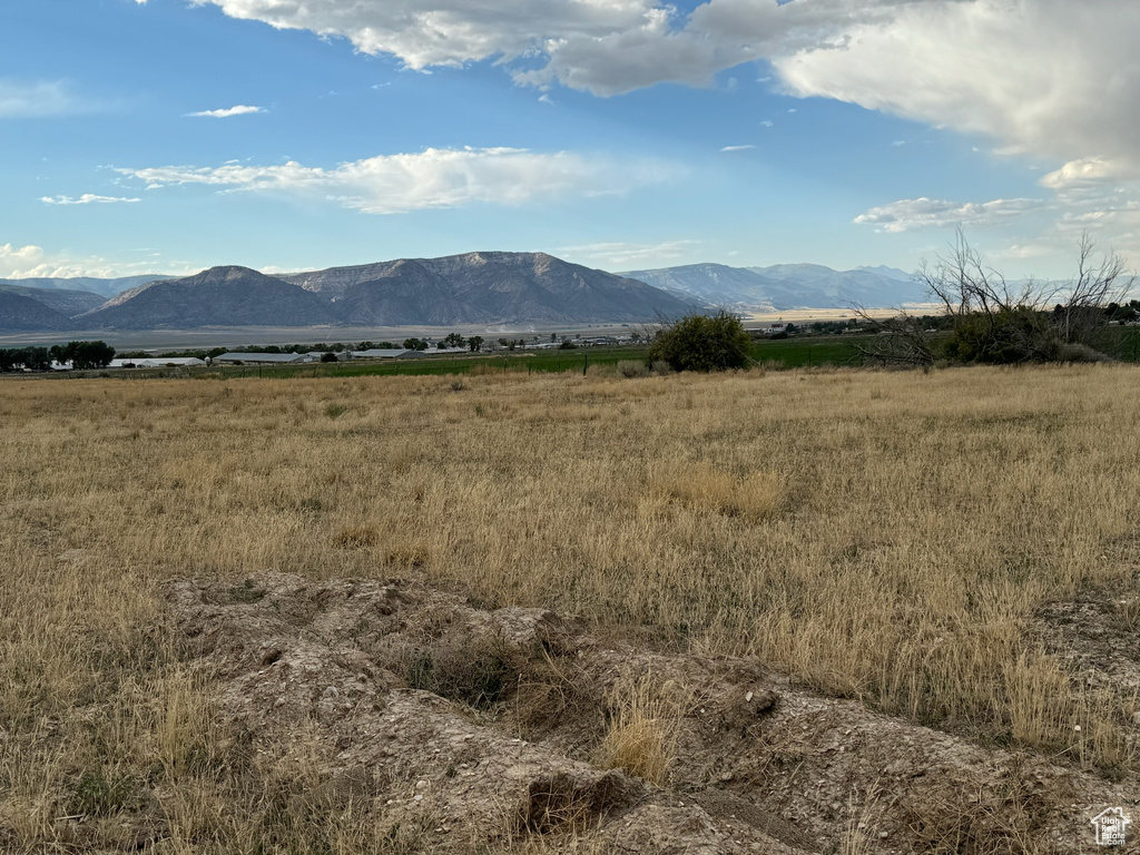 Property view of mountains with a rural view