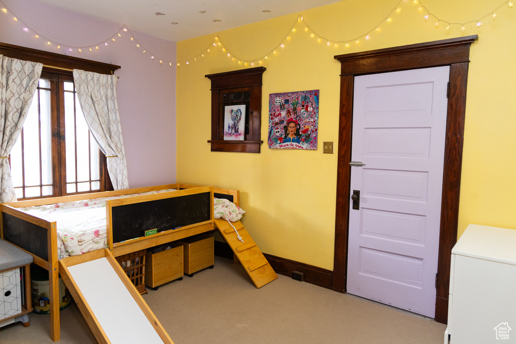 Carpeted bedroom with baseboards