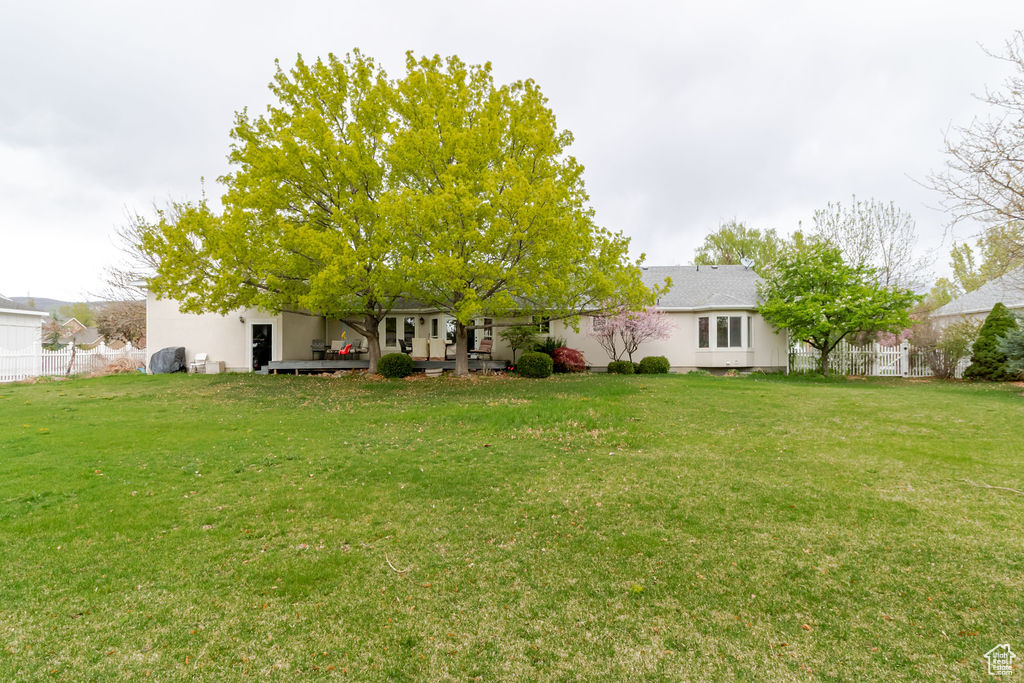 View of yard featuring fence