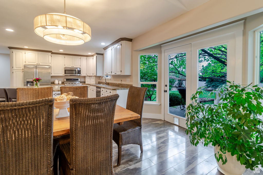 Dining space featuring recessed lighting