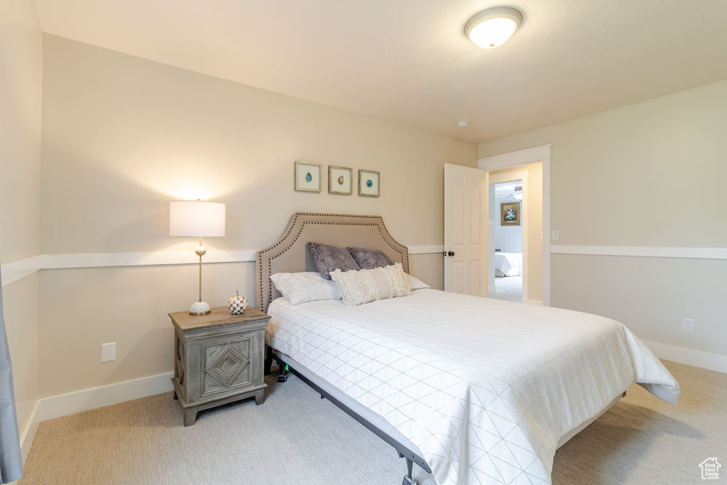 Bedroom with baseboards and carpet floors