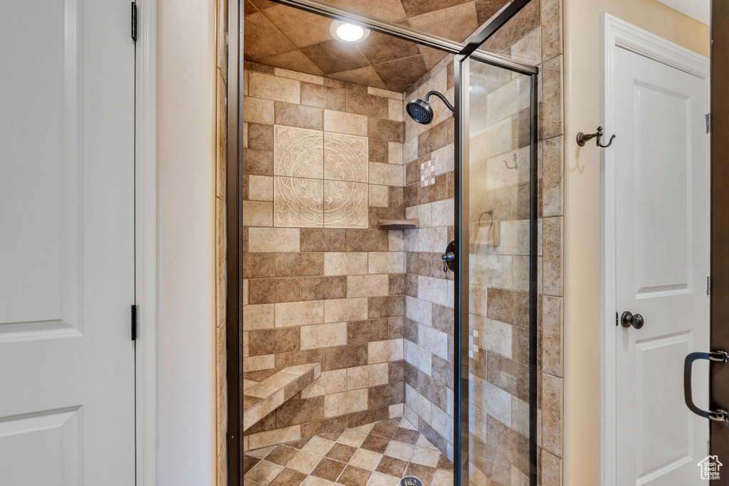 Full bathroom featuring a shower stall