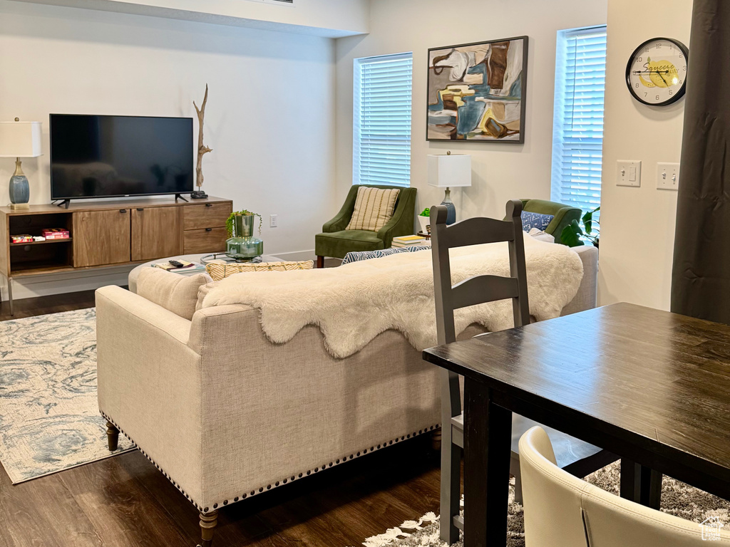 Living area with recessed lighting, a textured ceiling, visible vents, and dark wood-type flooring