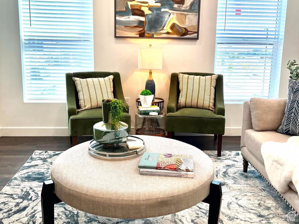 Living area featuring baseboards and wood finished floors