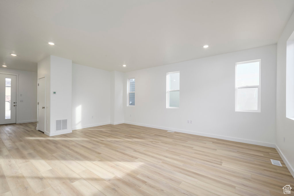Interior space featuring recessed lighting, baseboards, visible vents, and light wood-type flooring