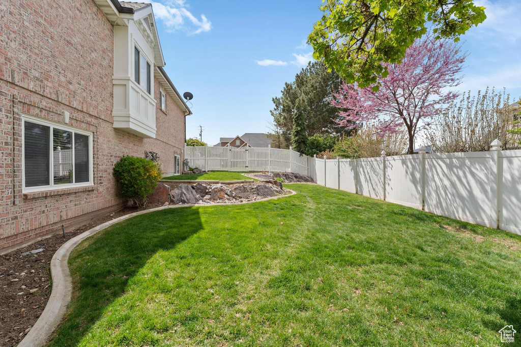 View of yard with a fenced backyard