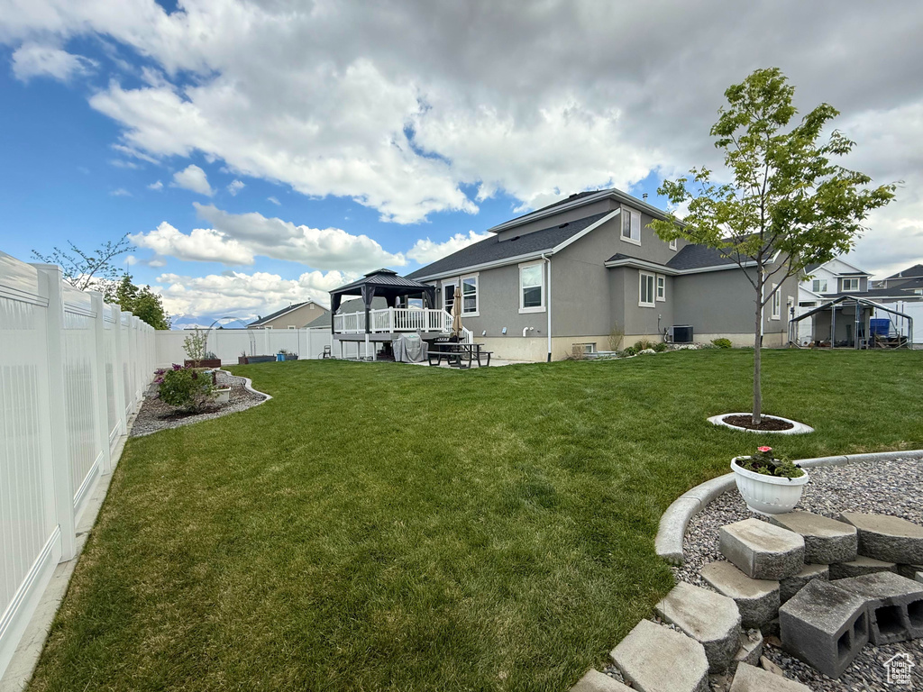 View of yard featuring a fenced backyard and a gazebo
