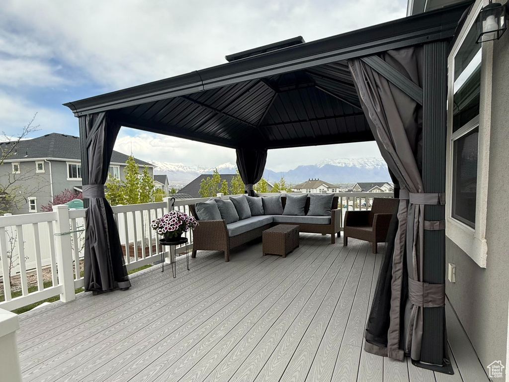 Deck with a gazebo and outdoor lounge area