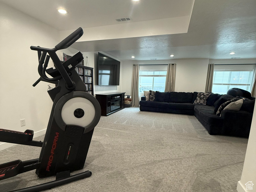 Workout area featuring recessed lighting, carpet, baseboards, and visible vents