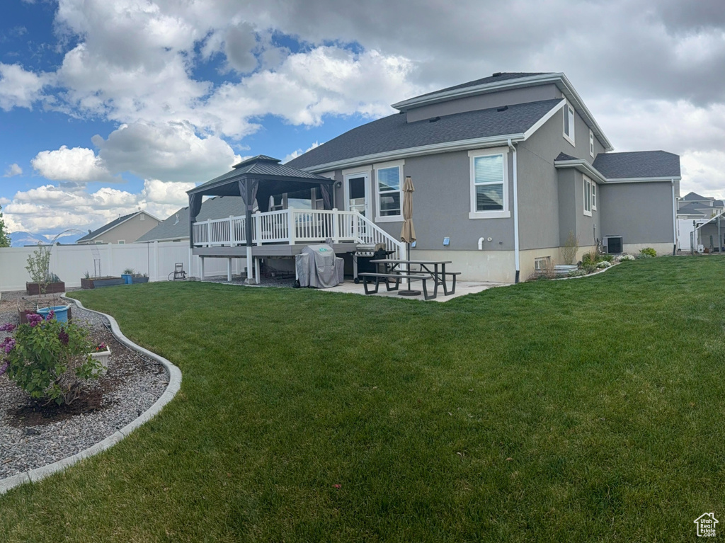 View of yard featuring a patio, a residential view, a fenced backyard, and a trampoline