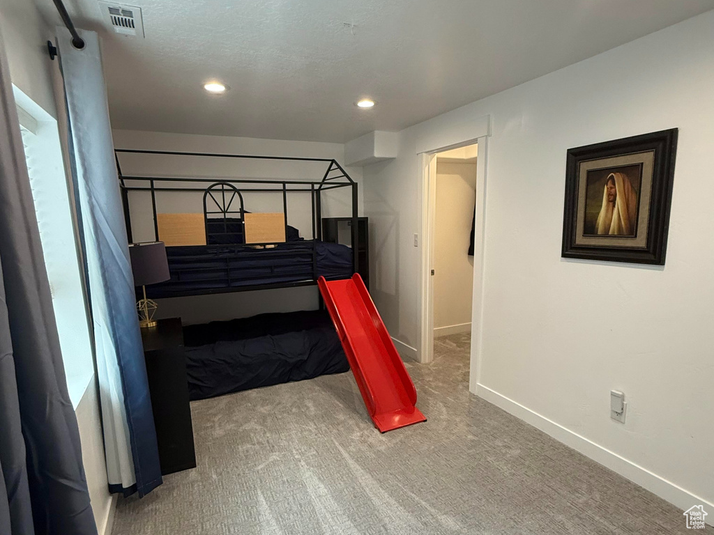 Bedroom featuring visible vents, carpet flooring, baseboards, and recessed lighting
