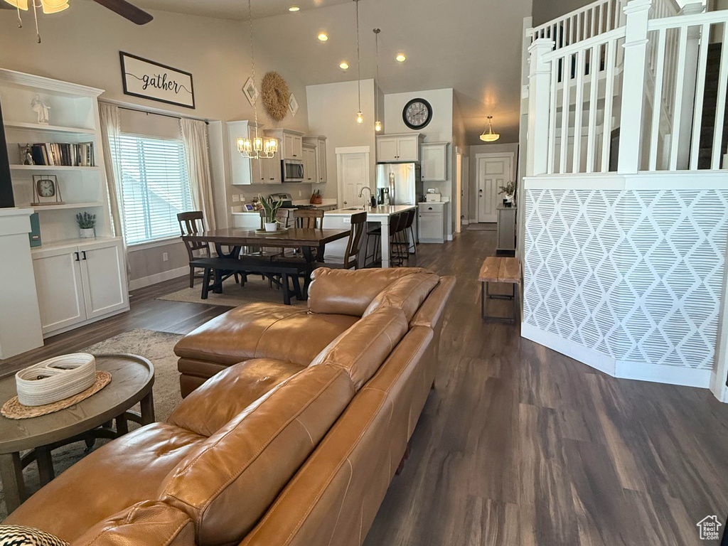 Living area with visible vents, a ceiling fan, recessed lighting, and dark wood-type flooring