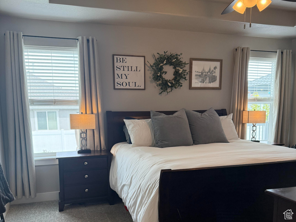 Bedroom with carpet flooring and ceiling fan