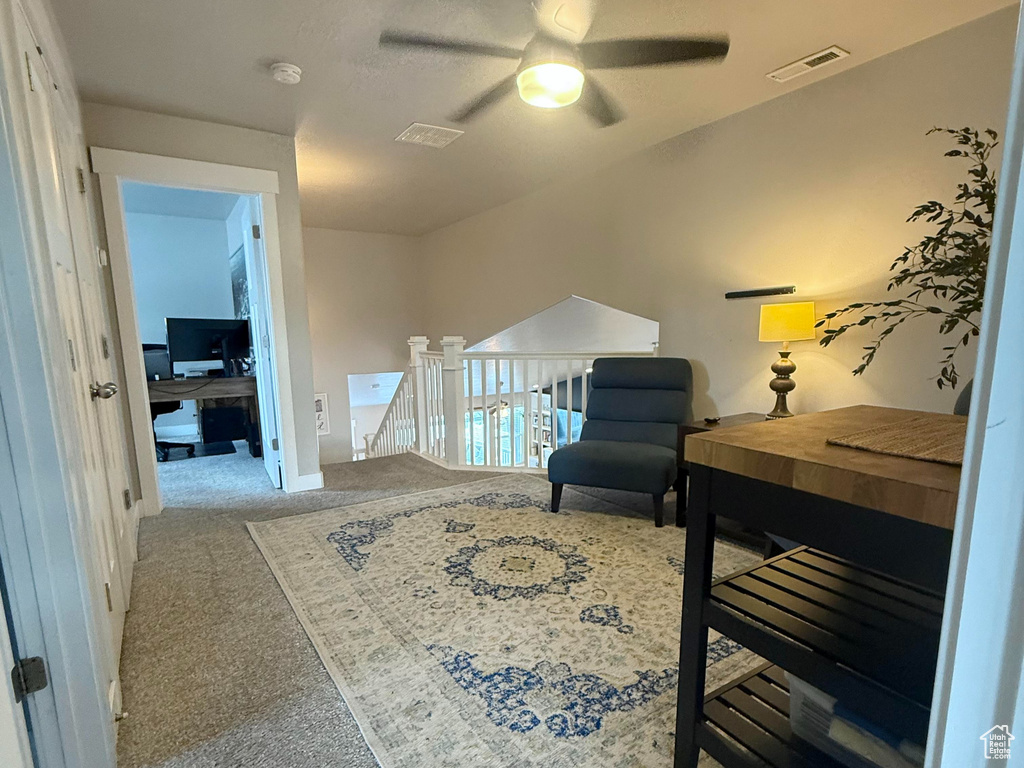 Carpeted bedroom featuring baseboards, a textured ceiling, visible vents, and ceiling fan