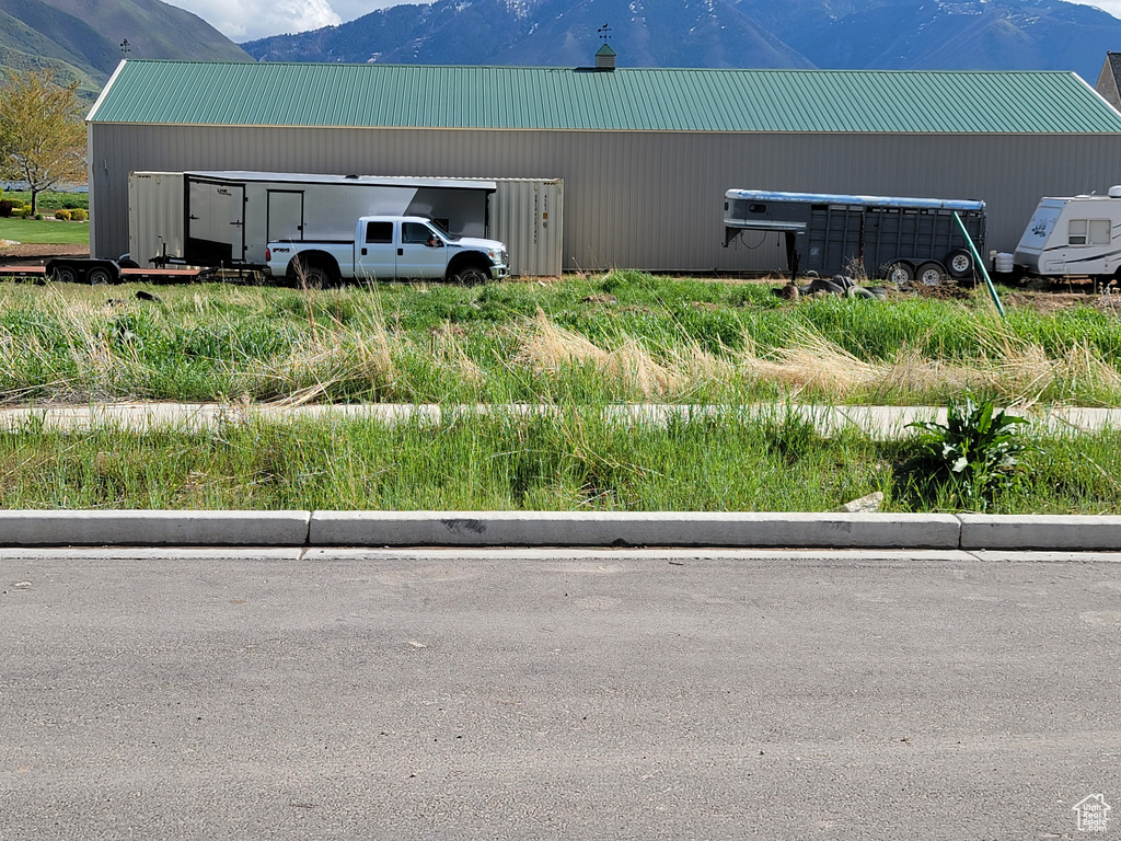 Exterior space featuring a mountain view and metal roof