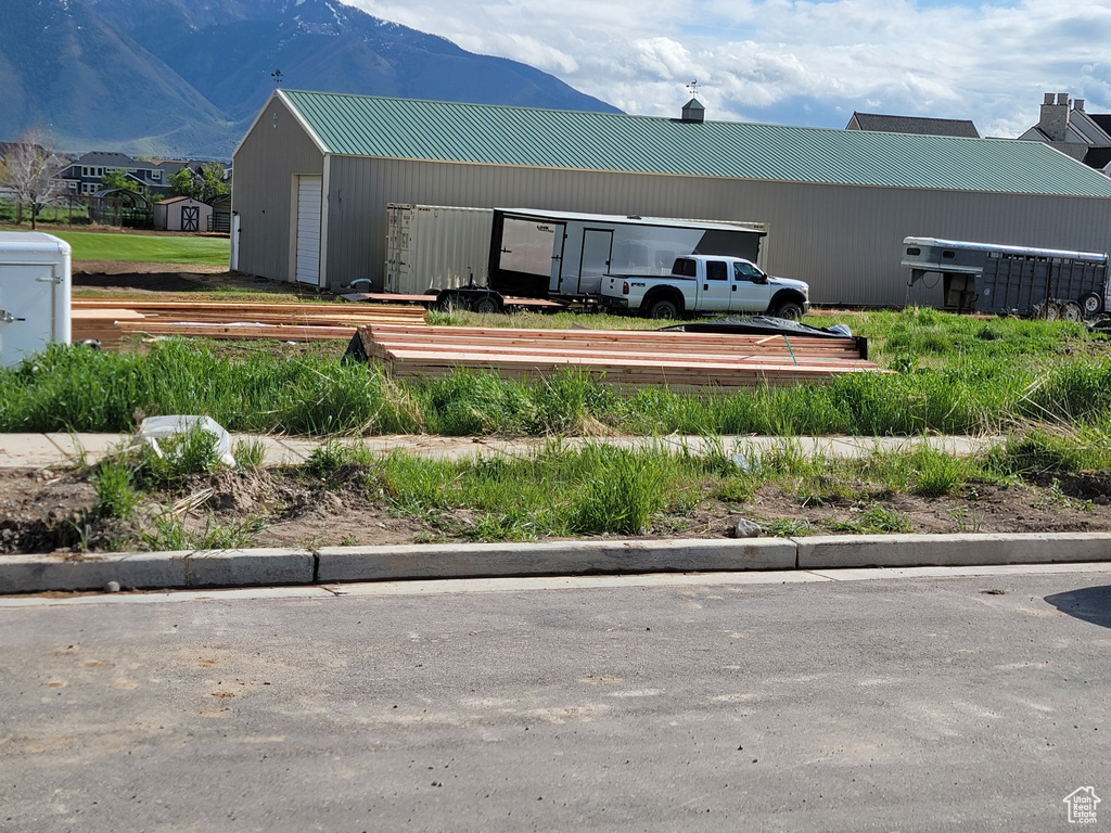 Exterior space with a mountain view and metal roof