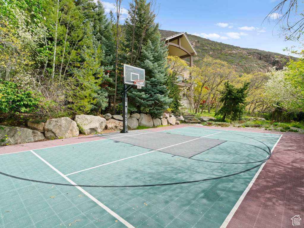 View of sport court with community basketball court and a mountain view
